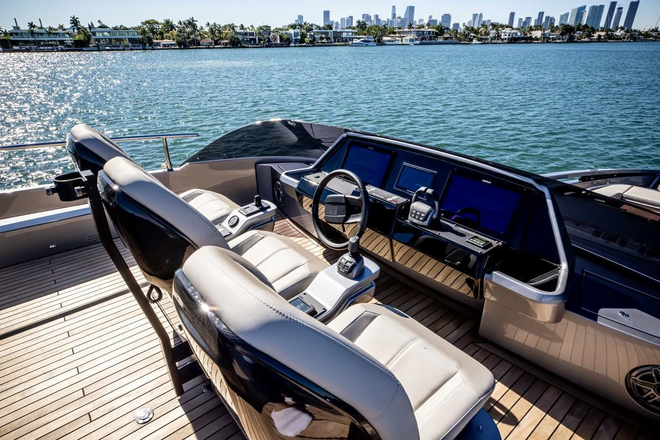 The helm station offers a sleek and modern design with a stunning view of the water and city skyline. aboard CIAO Yacht for Sale