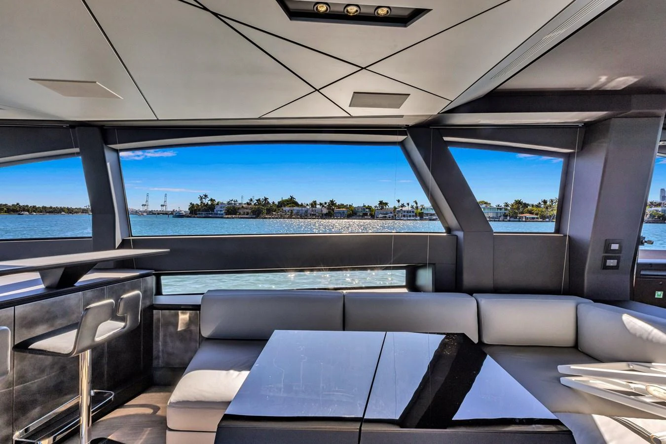 The salon offers a luxurious seating area with panoramic views of the water. aboard CIAO Yacht for Sale