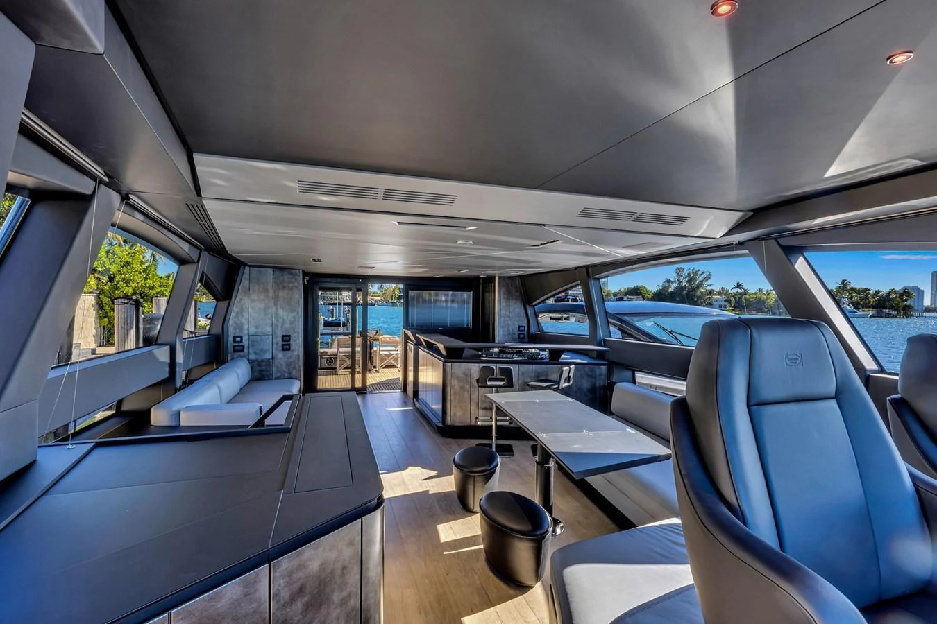 The salon offers a spacious and modern interior with ample seating and large windows for panoramic views. aboard CIAO Yacht for Sale