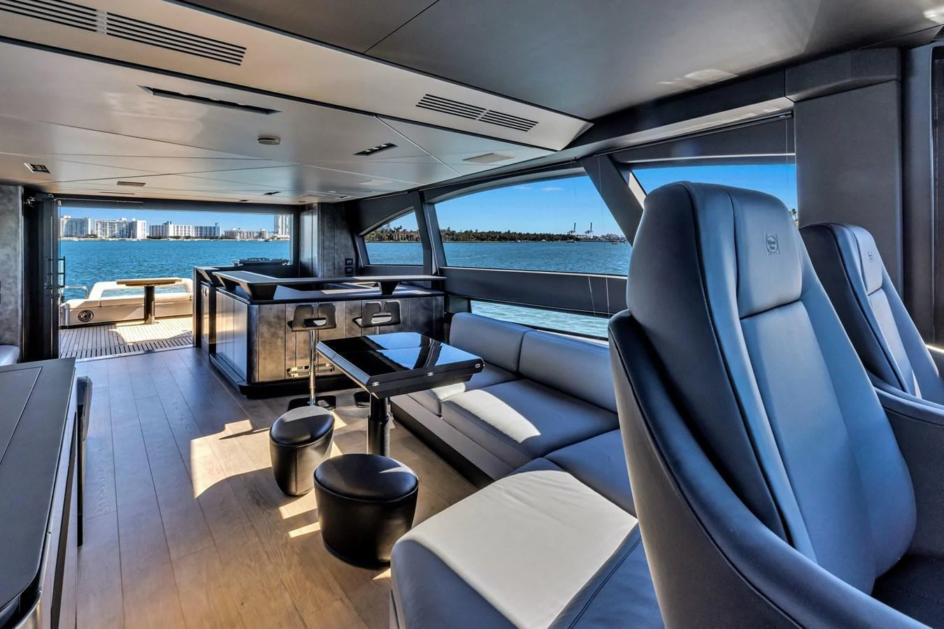 The salon offers a spacious and modern interior with panoramic views of the water. aboard CIAO Yacht for Sale