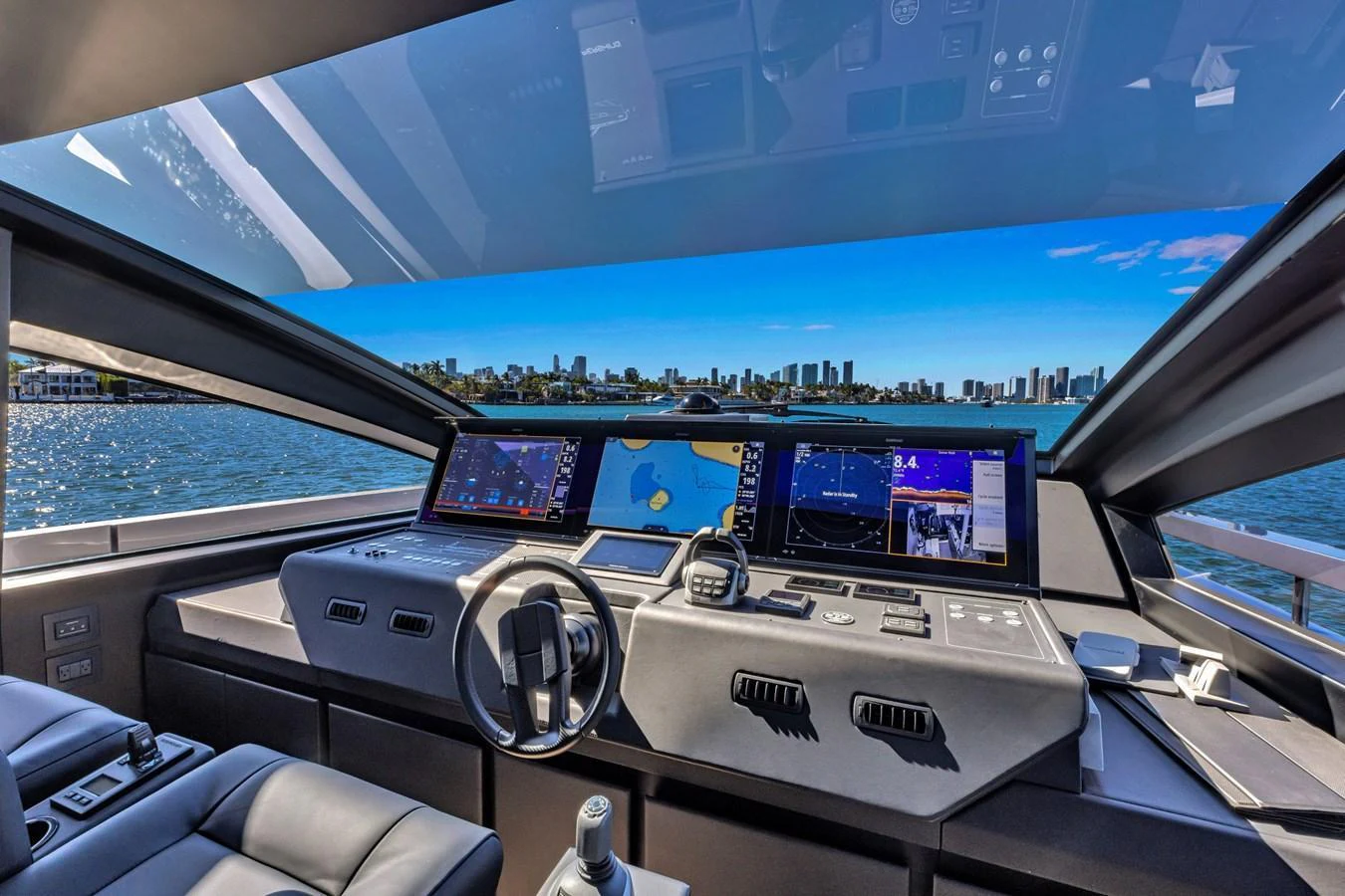 The helm station offers a panoramic view with state-of-the-art navigation equipment and luxurious seating. aboard CIAO Yacht for Sale
