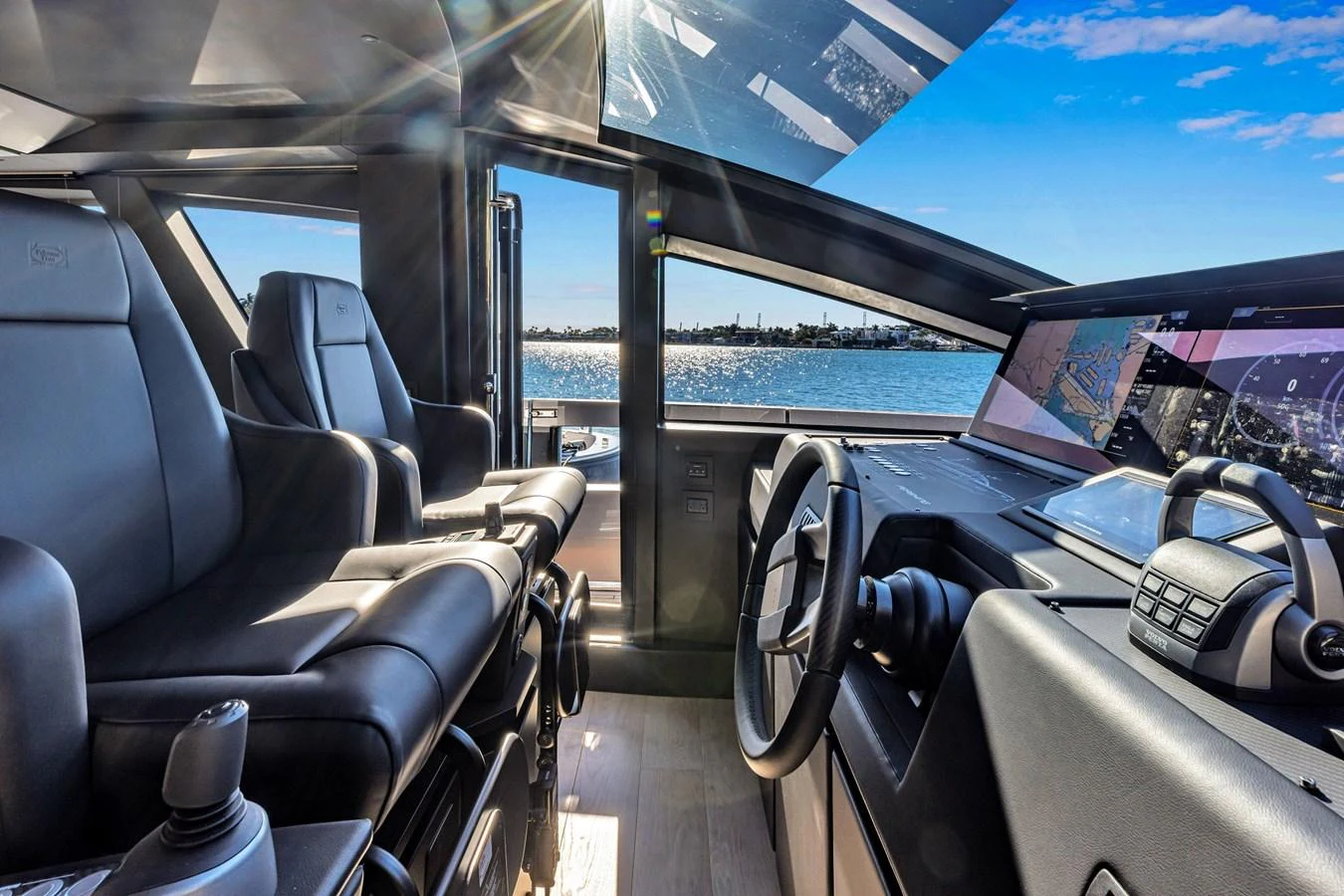 The helm station offers a sleek and modern design with advanced navigation equipment and comfortable seating. aboard CIAO Yacht for Sale