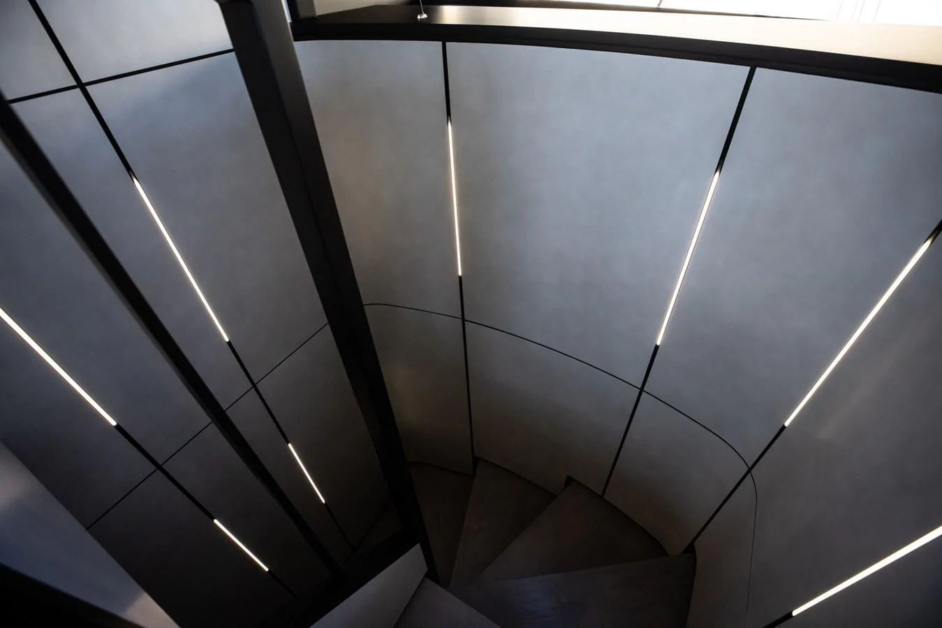 A modern, sleek staircase with minimalist lighting design. aboard CIAO Yacht for Sale
