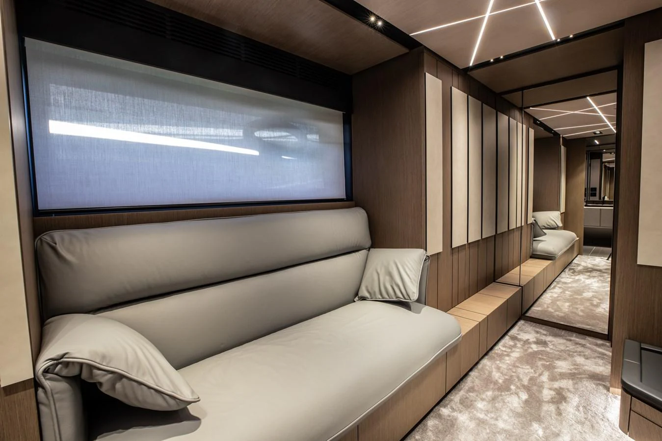 The yacht's interior features a modern and comfortable seating area with sleek design elements. aboard CIAO Yacht for Sale