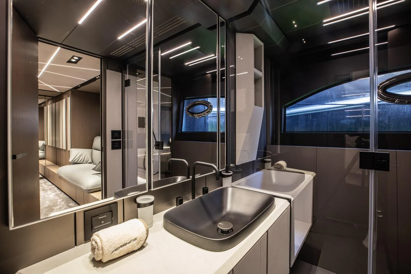 A sleek and modern bathroom with contemporary fixtures and a luxurious ambiance. aboard CIAO Yacht for Sale