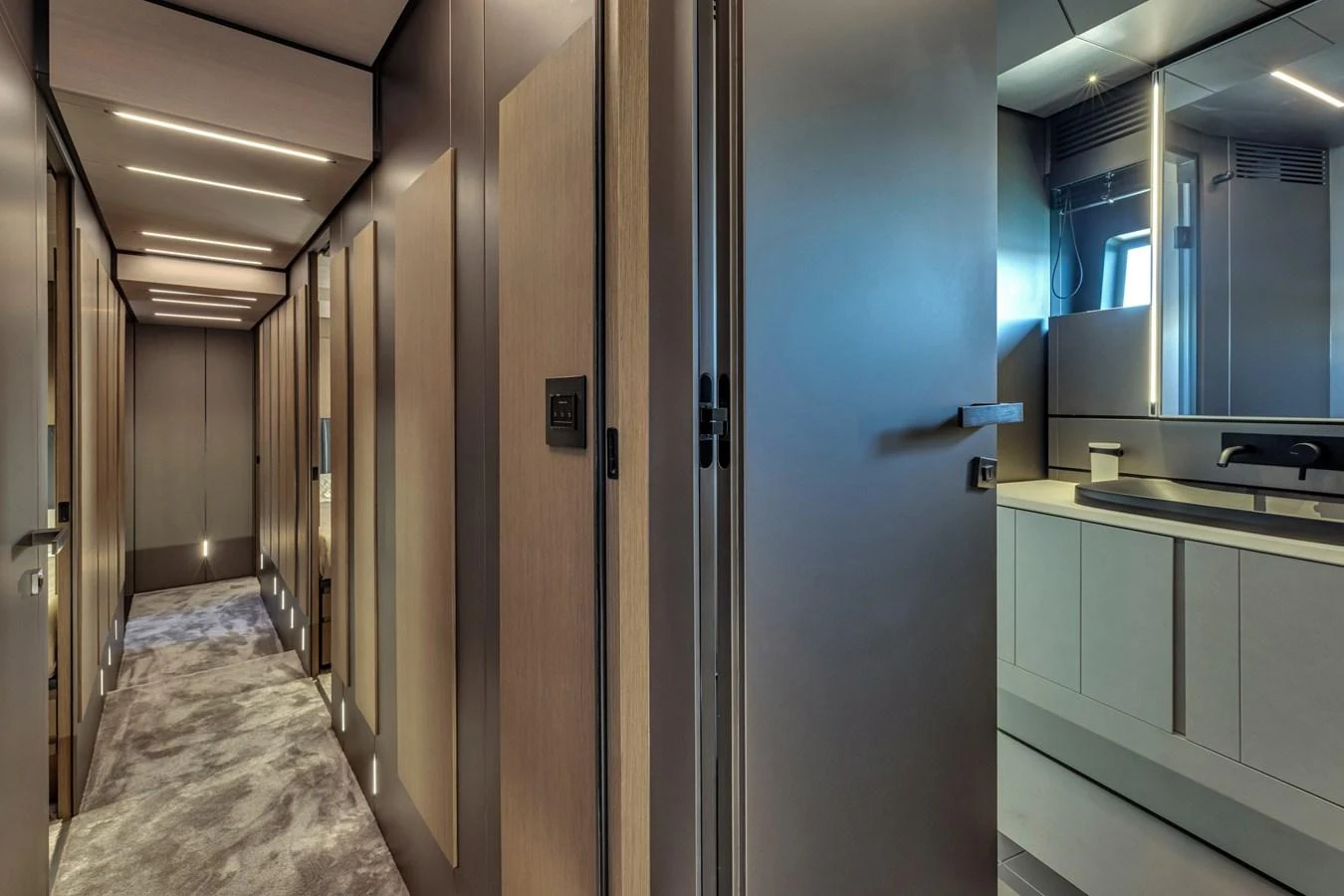 The yacht's interior hallway features modern design with sleek lines and ambient lighting. aboard CIAO Yacht for Sale