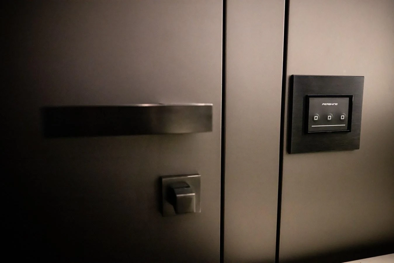 A close-up of a sleek, modern control panel and door handle on the yacht. aboard CIAO Yacht for Sale