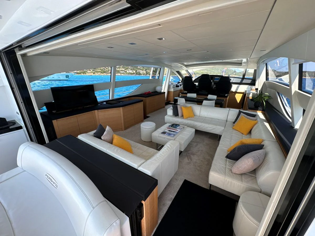 The spacious salon features luxurious seating with panoramic views of the surrounding waters. aboard THYKE III Yacht for Sale