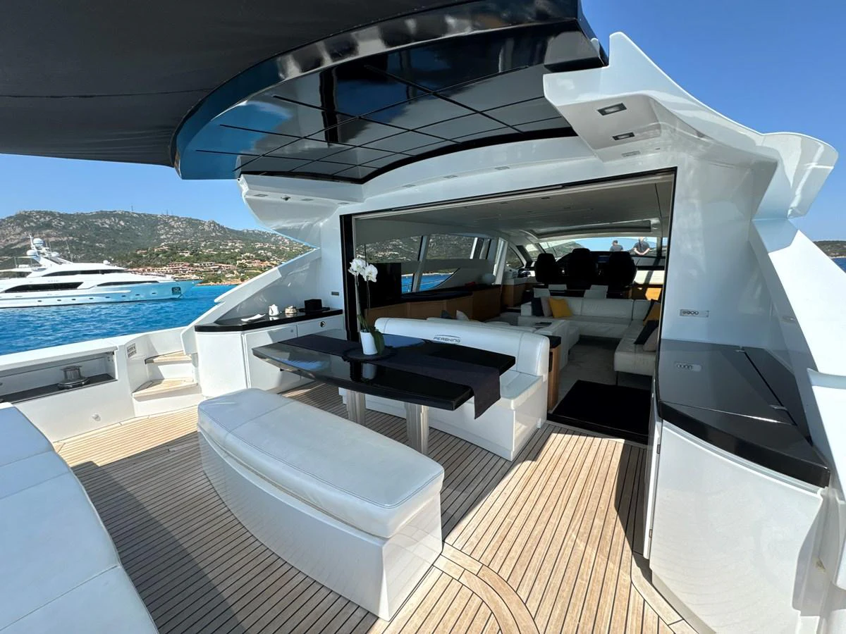 The yacht's aft deck features a stylish and spacious lounging area with seamless indoor-outdoor flow. aboard THYKE III Yacht for Sale