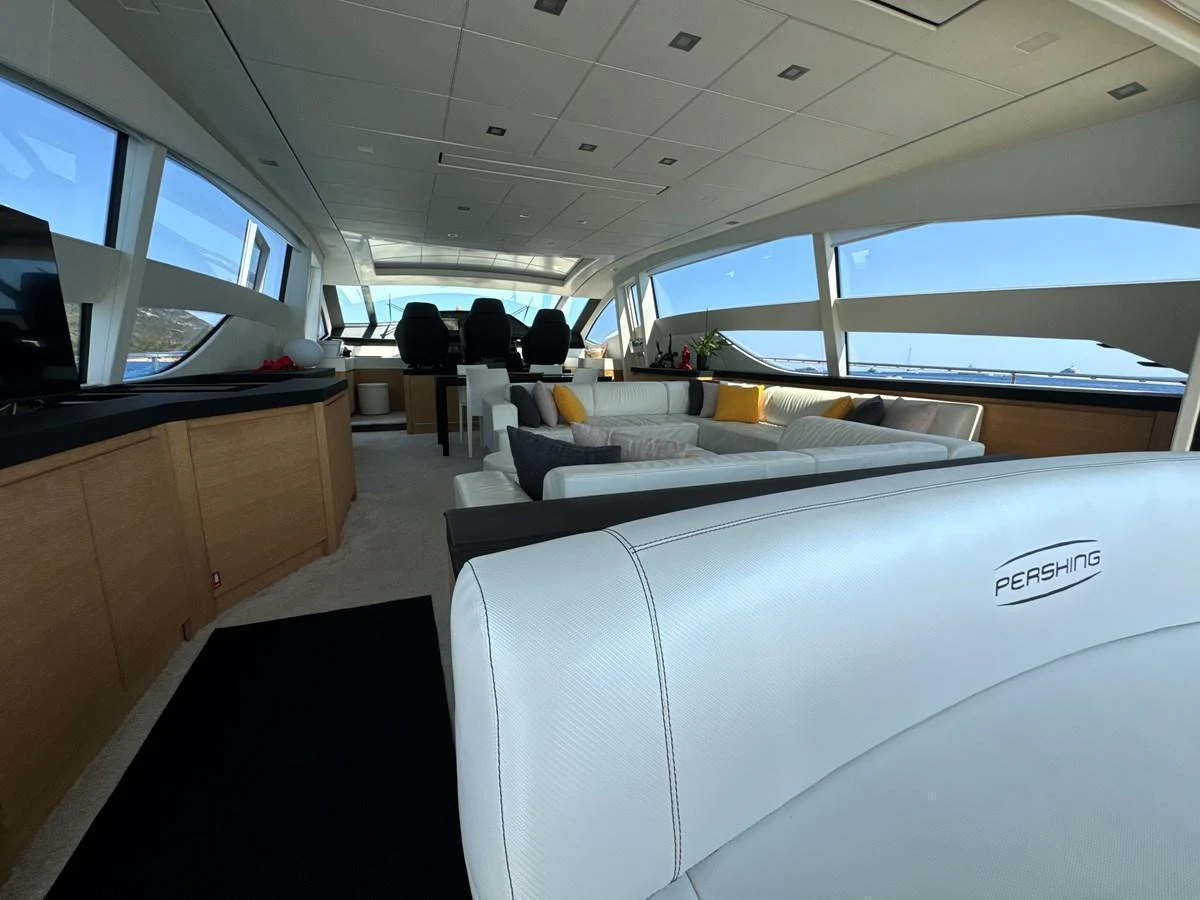 The salon features luxurious seating with panoramic windows offering stunning views. aboard THYKE III Yacht for Sale
