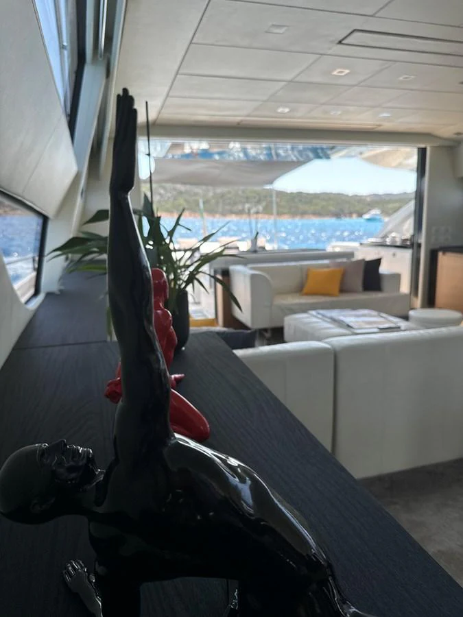 The yacht's interior features a modern, stylish lounge area with large windows offering stunning sea views. aboard THYKE III Yacht for Sale