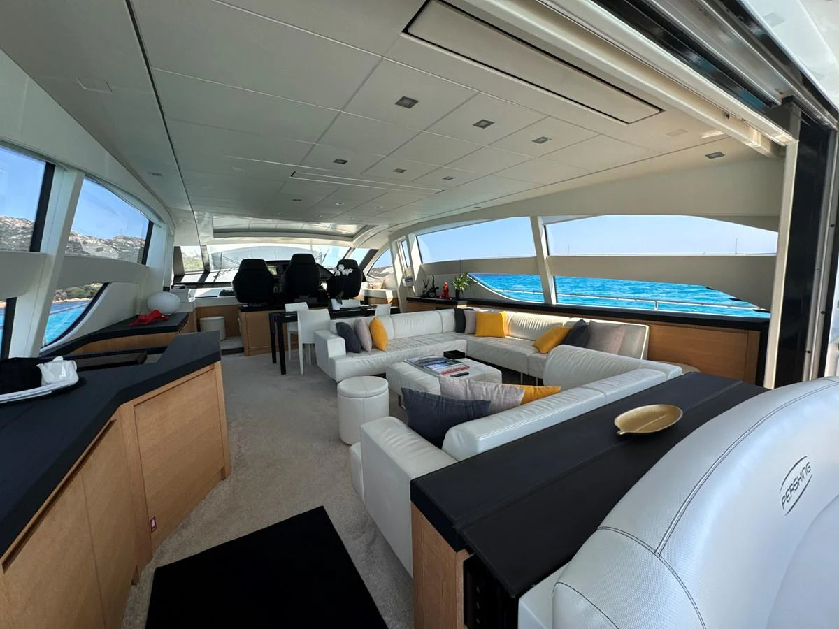 The spacious salon features luxurious seating with panoramic views of the ocean. aboard THYKE III Yacht for Sale