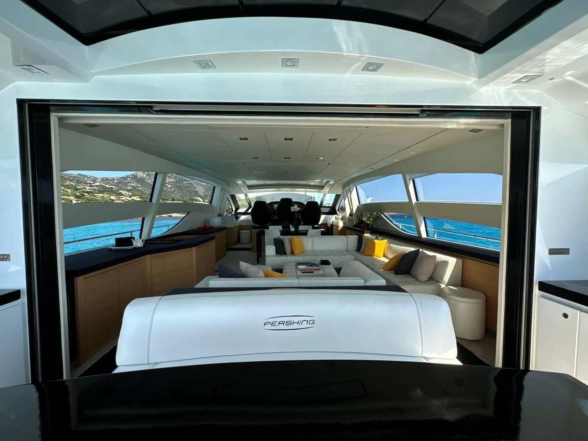 The salon features a spacious and modern design with panoramic windows offering stunning sea views. aboard THYKE III Yacht for Sale
