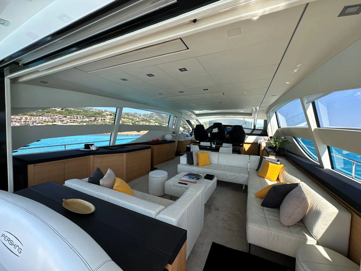 The salon features luxurious seating with panoramic views of the surrounding waters. aboard THYKE III Yacht for Sale