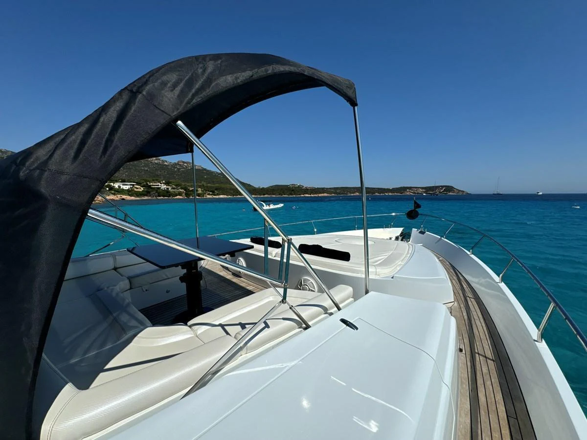 The foredeck of the yacht offers a spacious sunbathing area with stunning views of the turquoise waters. aboard THYKE III Yacht for Sale