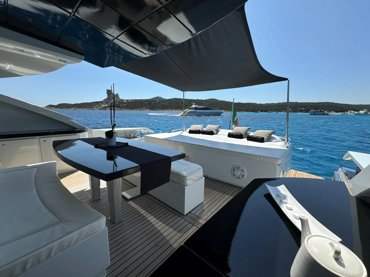 The aft deck offers a luxurious outdoor dining area with stunning sea views. aboard THYKE III Yacht for Sale