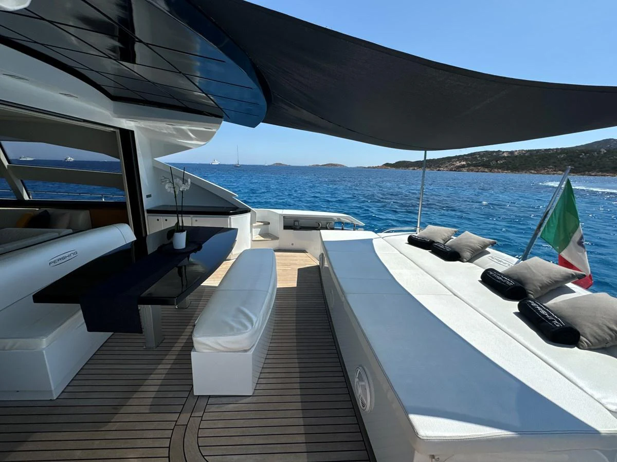 The aft deck offers a luxurious lounging area with comfortable seating and a stunning view of the sea. aboard THYKE III Yacht for Sale