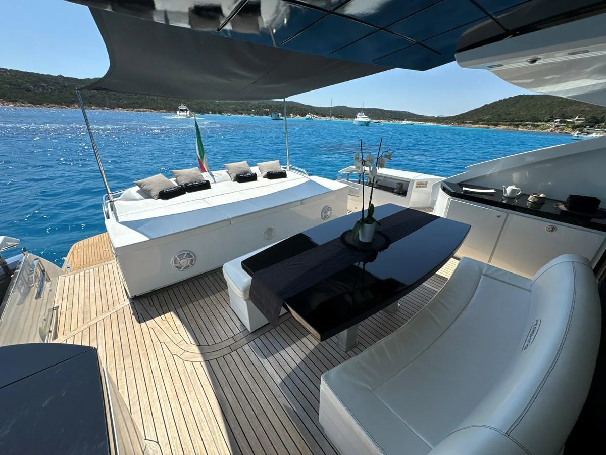 The aft deck offers a luxurious outdoor lounging and dining area with stunning views of the surrounding waters. aboard THYKE III Yacht for Sale