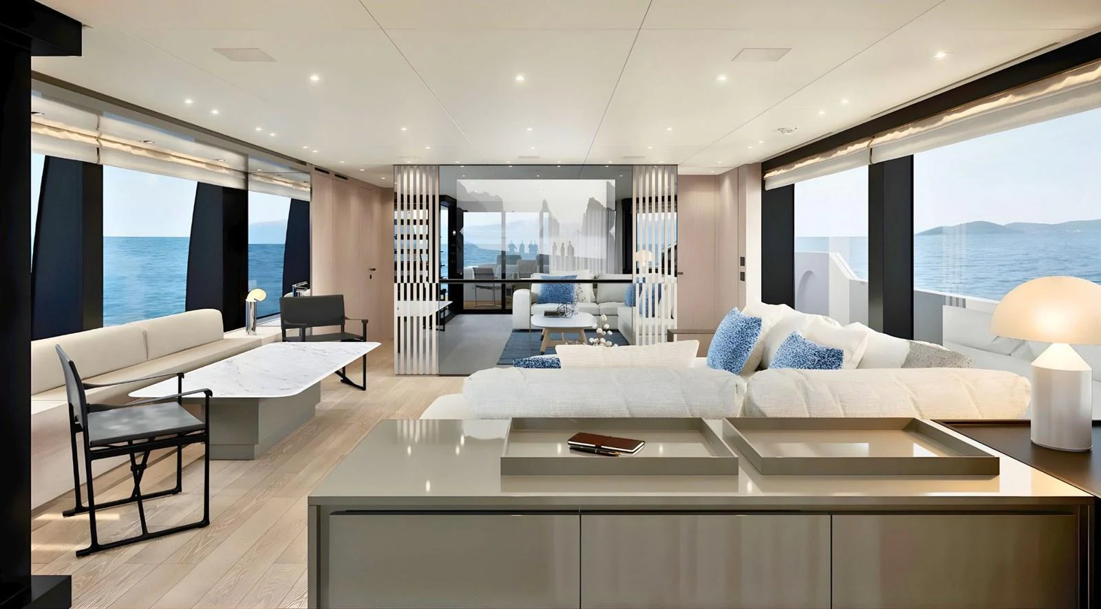 a modern living room with a large white sofa and a large window aboard SANLORENZO SL96 ASYMMETRIC #894 Yacht for Sale