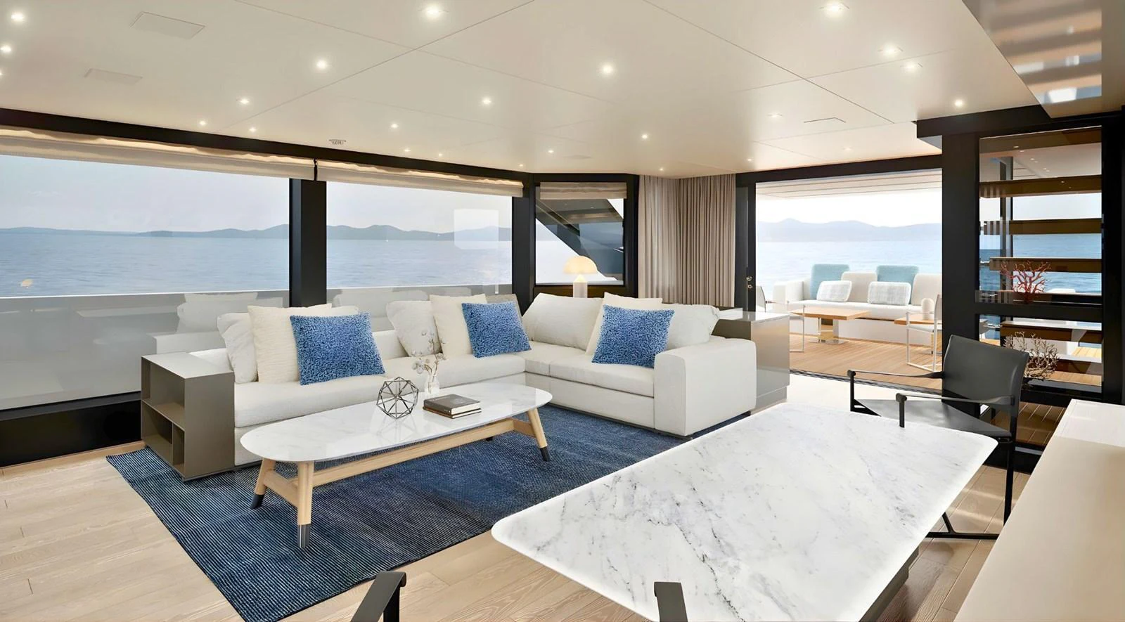 a large living room with a large white couch and a large white table aboard SANLORENZO SL96 ASYMMETRIC #894 Yacht for Sale