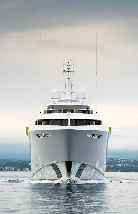 A sleek yacht cuts through the water, showcasing its impressive bow and modern design. aboard SOLEMATES Yacht for Sale