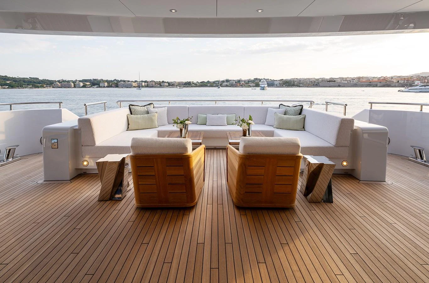 The aft deck offers a spacious and inviting seating area with a stunning view of the water. aboard SOLEMATES Yacht for Sale