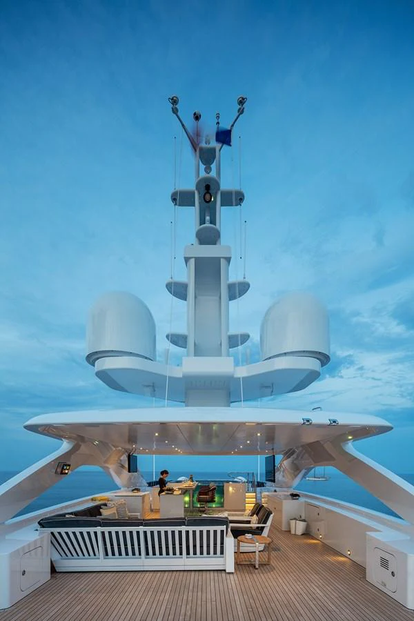 The sundeck offers a luxurious space for relaxation with modern amenities under a serene sky. aboard SOLEMATES Yacht for Sale