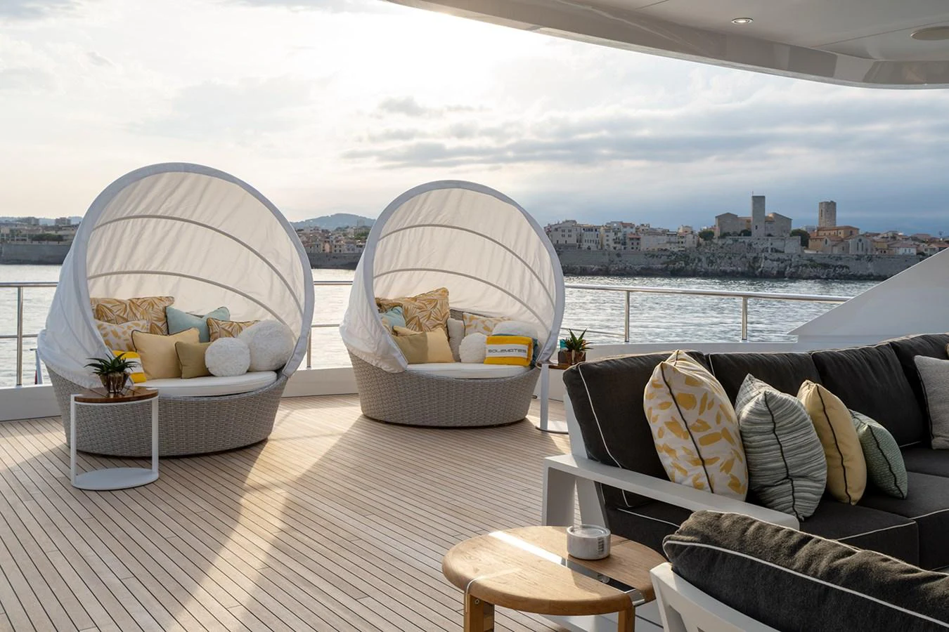 The sundeck offers a luxurious lounging area with comfortable seating and stunning views. aboard SOLEMATES Yacht for Sale
