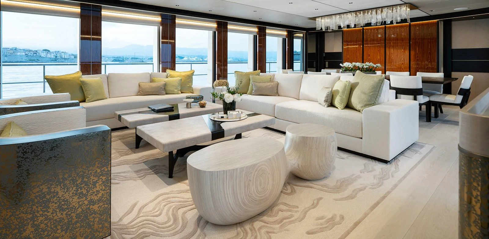 The salon features elegant seating with panoramic views and luxurious decor. aboard SOLEMATES Yacht for Sale