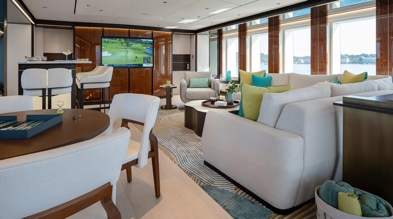 The salon offers a spacious and elegant setting with plush seating and a large television for entertainment. aboard SOLEMATES Yacht for Sale