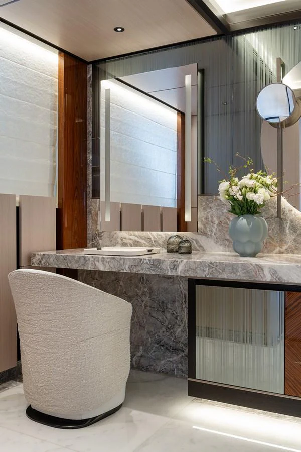 The bathroom features elegant marble surfaces and modern fixtures, exuding luxury and sophistication. aboard SOLEMATES Yacht for Sale