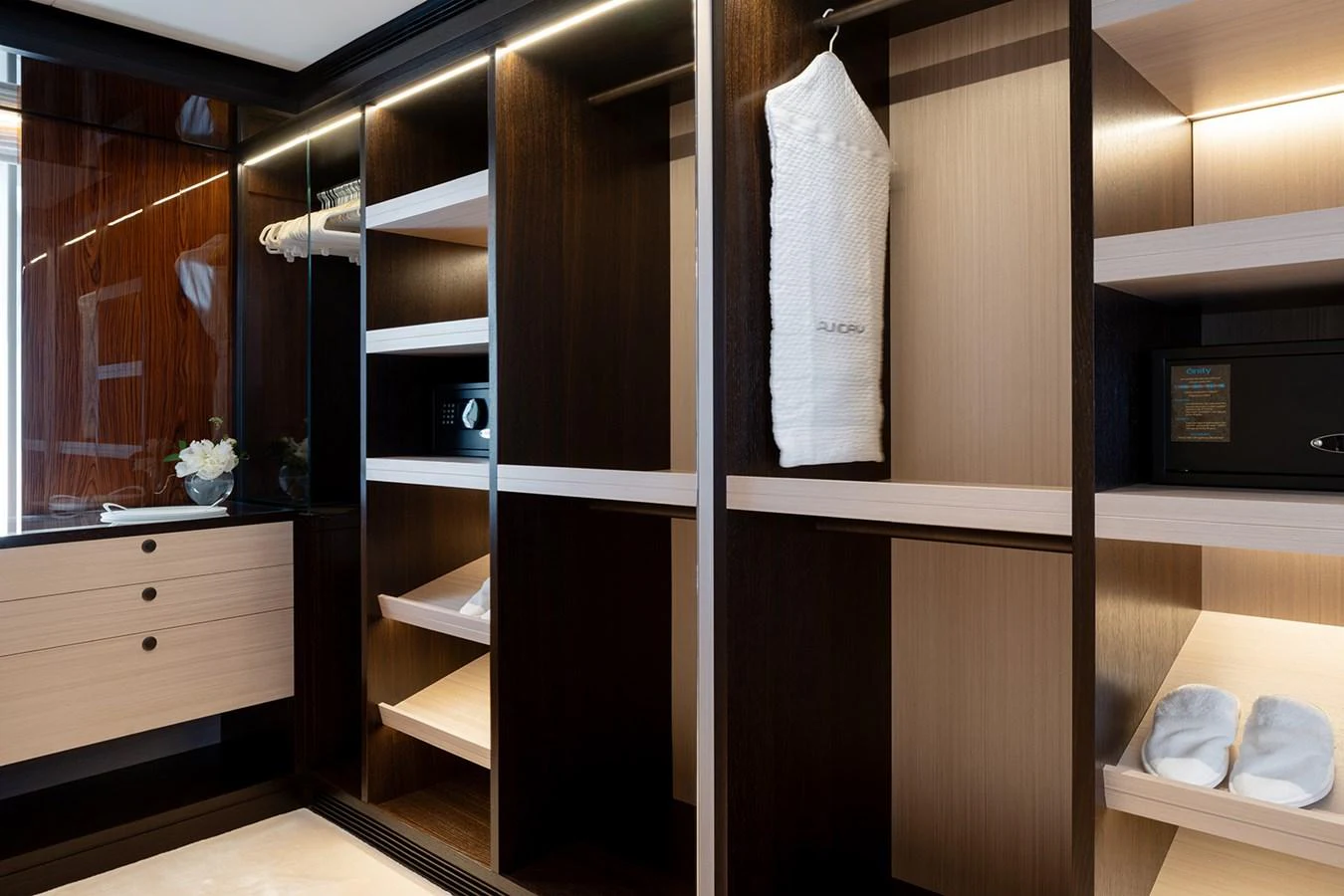 A luxurious yacht closet with ample storage and elegant finishes. aboard SOLEMATES Yacht for Sale