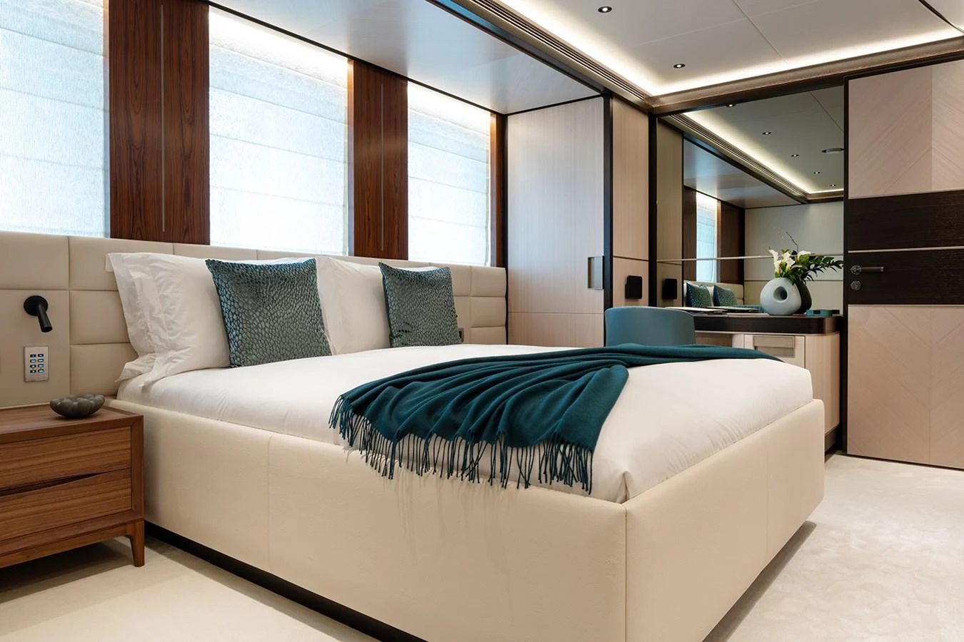 The stateroom features a luxurious bed with elegant decor and modern furnishings. aboard SOLEMATES Yacht for Sale