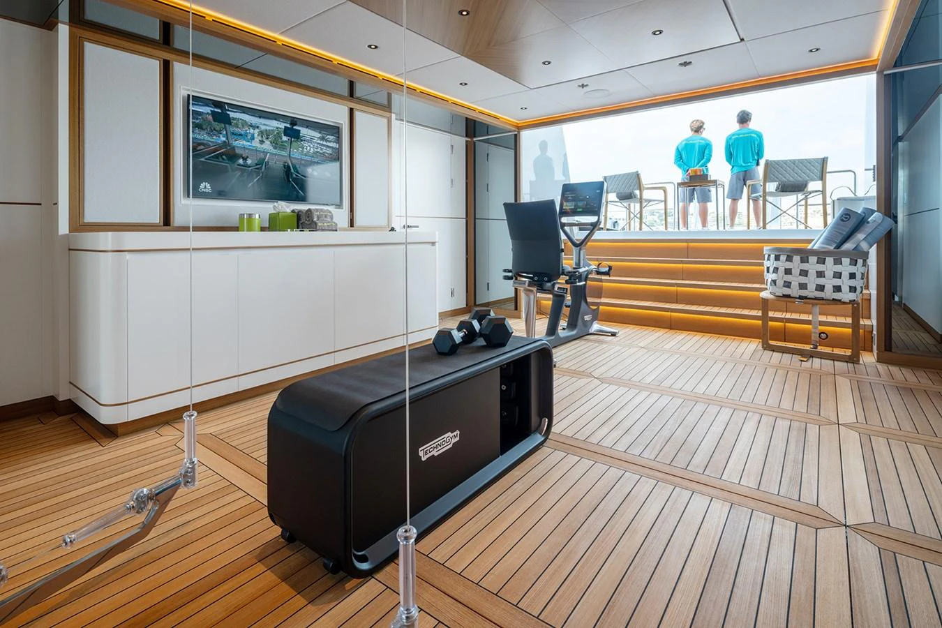 The yacht's gym features modern equipment and a serene view for an invigorating workout experience. aboard SOLEMATES Yacht for Sale