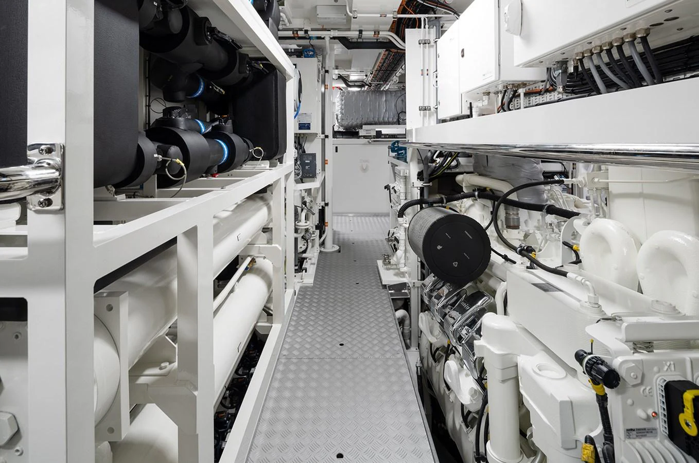 The image showcases the meticulously organized and high-tech engine room of the yacht. aboard SOLEMATES Yacht for Sale