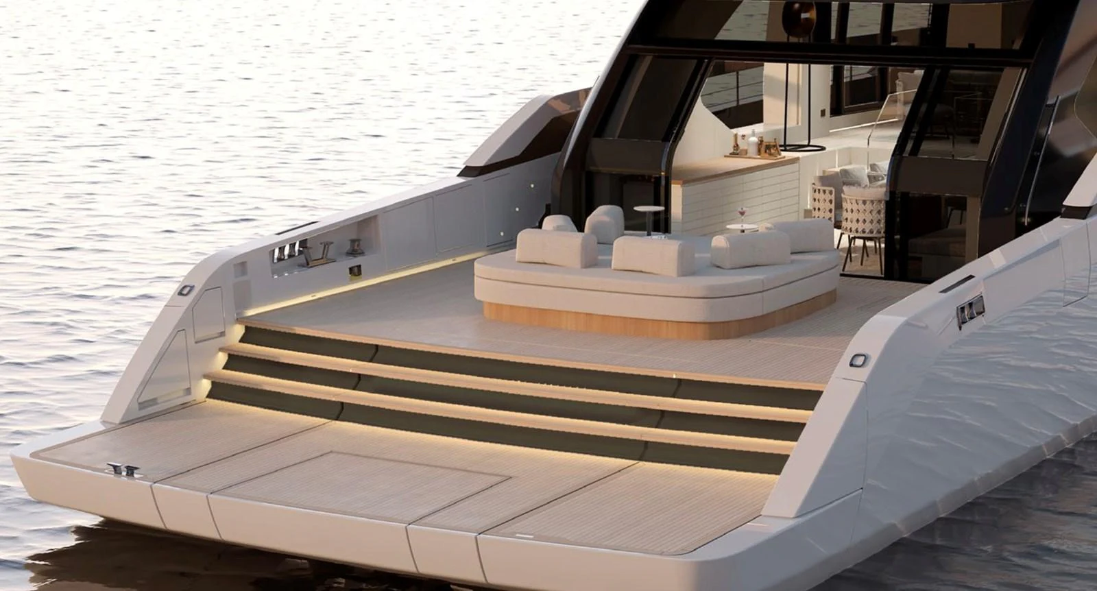 The yacht's aft deck features a luxurious lounging area with steps leading down to the water. aboard SP92 Yacht for Sale