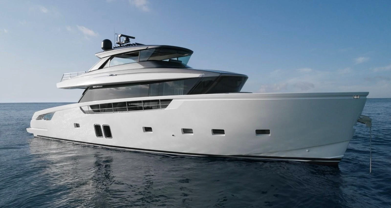 A sleek, modern yacht cruising on calm waters under a clear sky. aboard SX76 Yacht for Sale