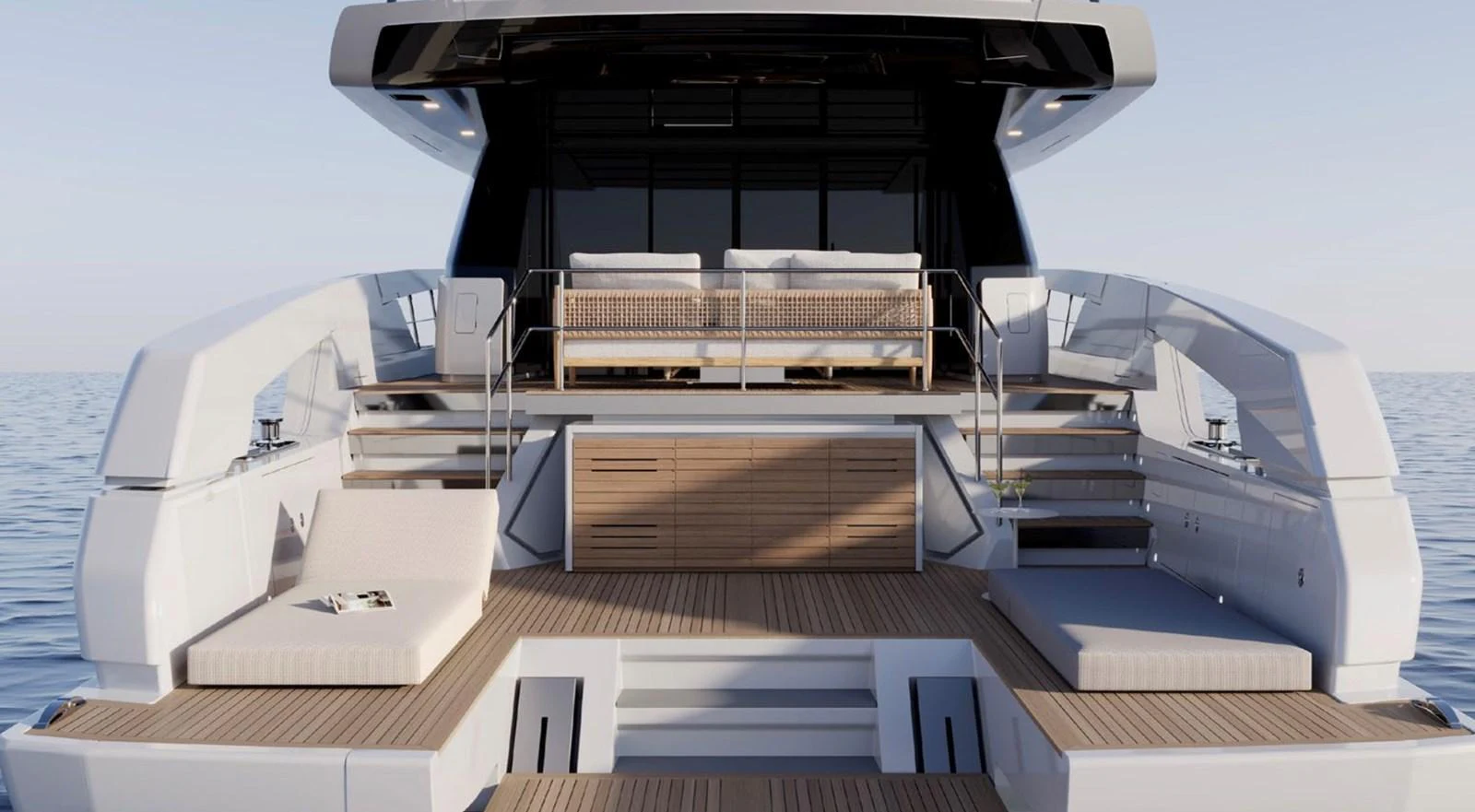 The yacht's aft deck features a spacious lounging area with elegant seating and a serene ocean backdrop. aboard SX76 Yacht for Sale