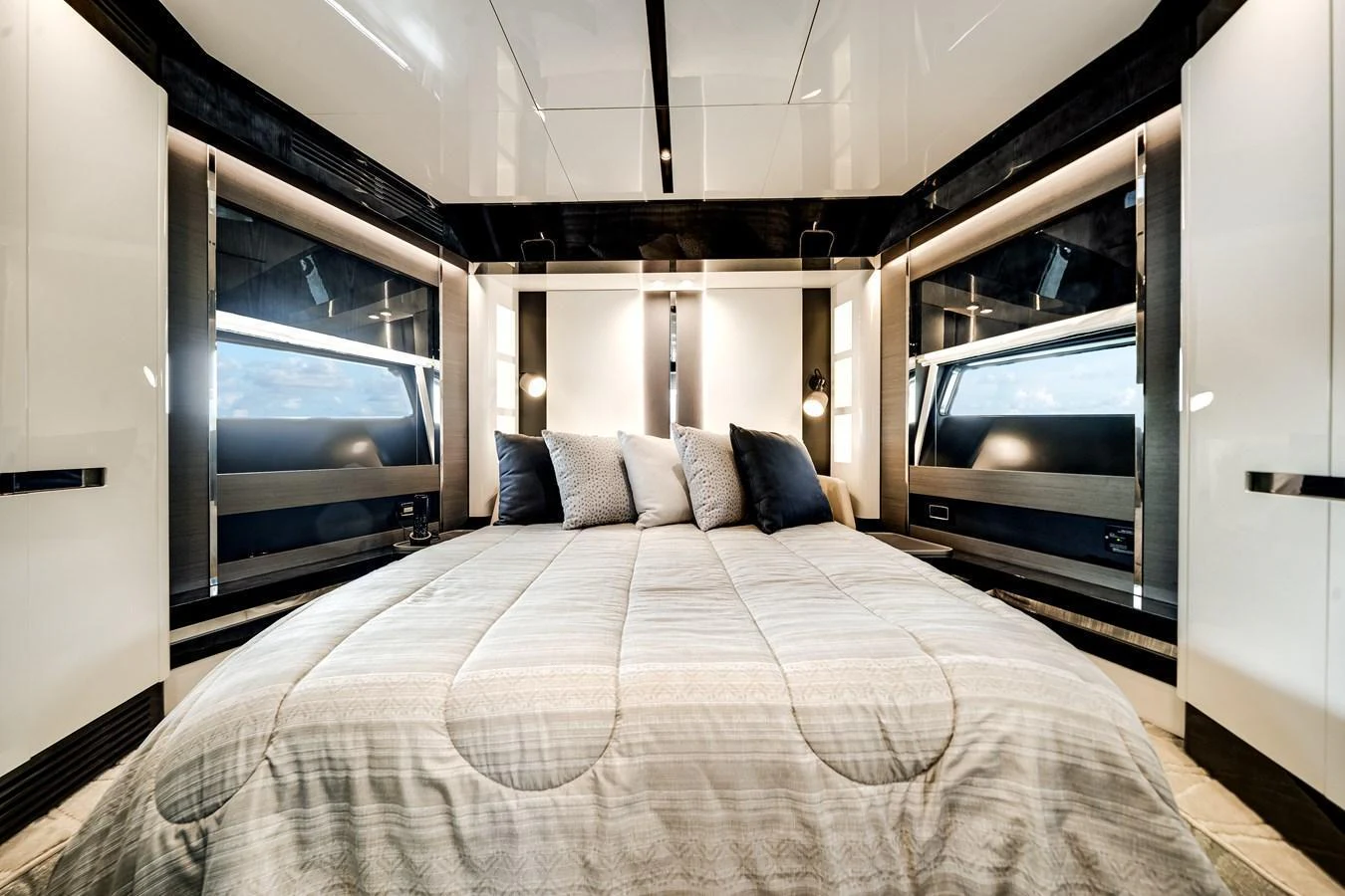 A luxurious stateroom featuring a plush bed and modern design elements. aboard PARTNERSHIP V Yacht for Sale