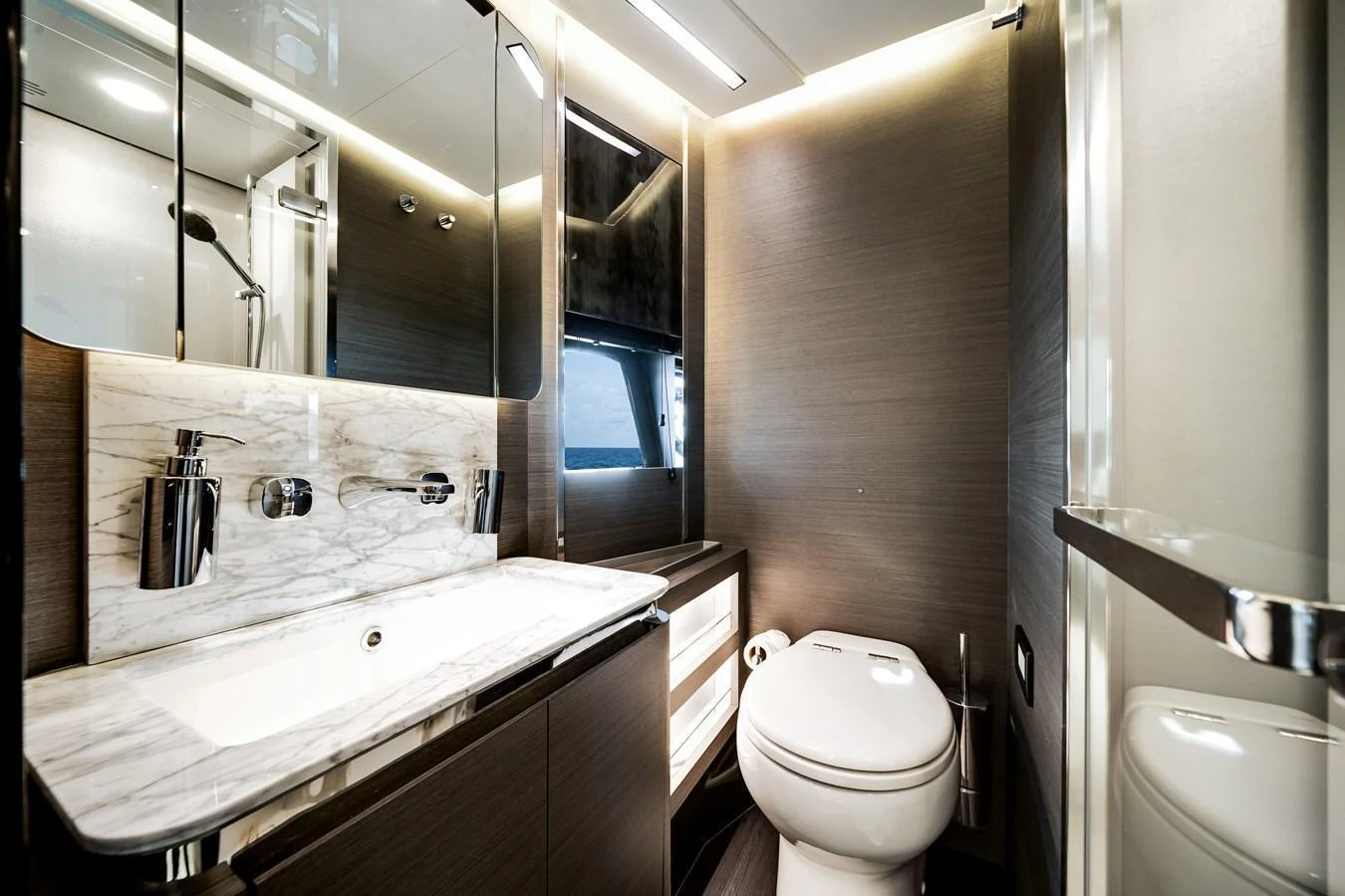 A sleek and modern yacht bathroom with elegant finishes and ample lighting. aboard PARTNERSHIP V Yacht for Sale