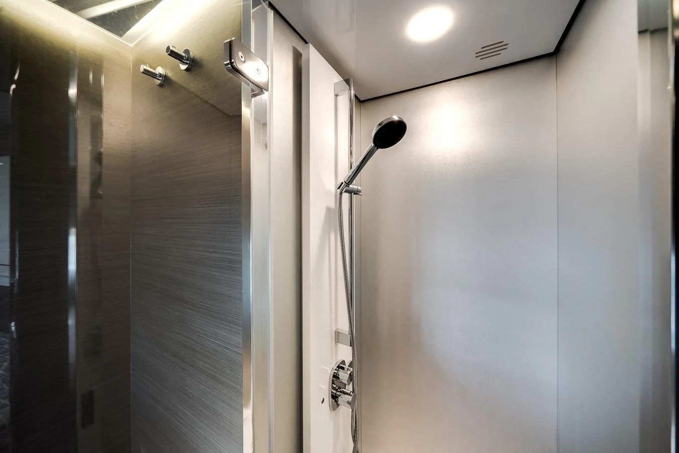 A sleek and modern shower area with stainless steel fixtures and a minimalist design. aboard PARTNERSHIP V Yacht for Sale