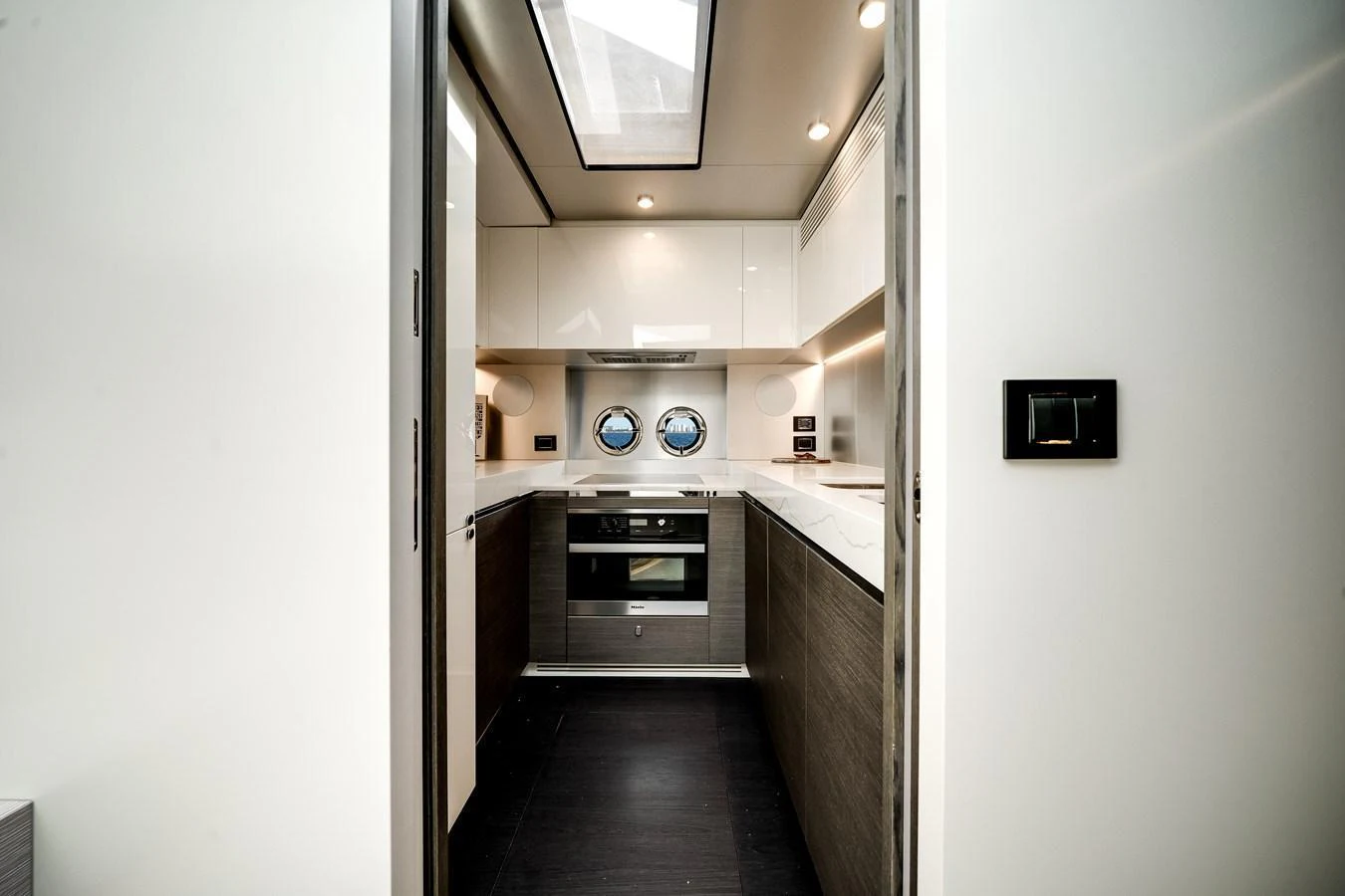 A sleek and modern galley with high-end appliances and ample lighting. aboard PARTNERSHIP V Yacht for Sale