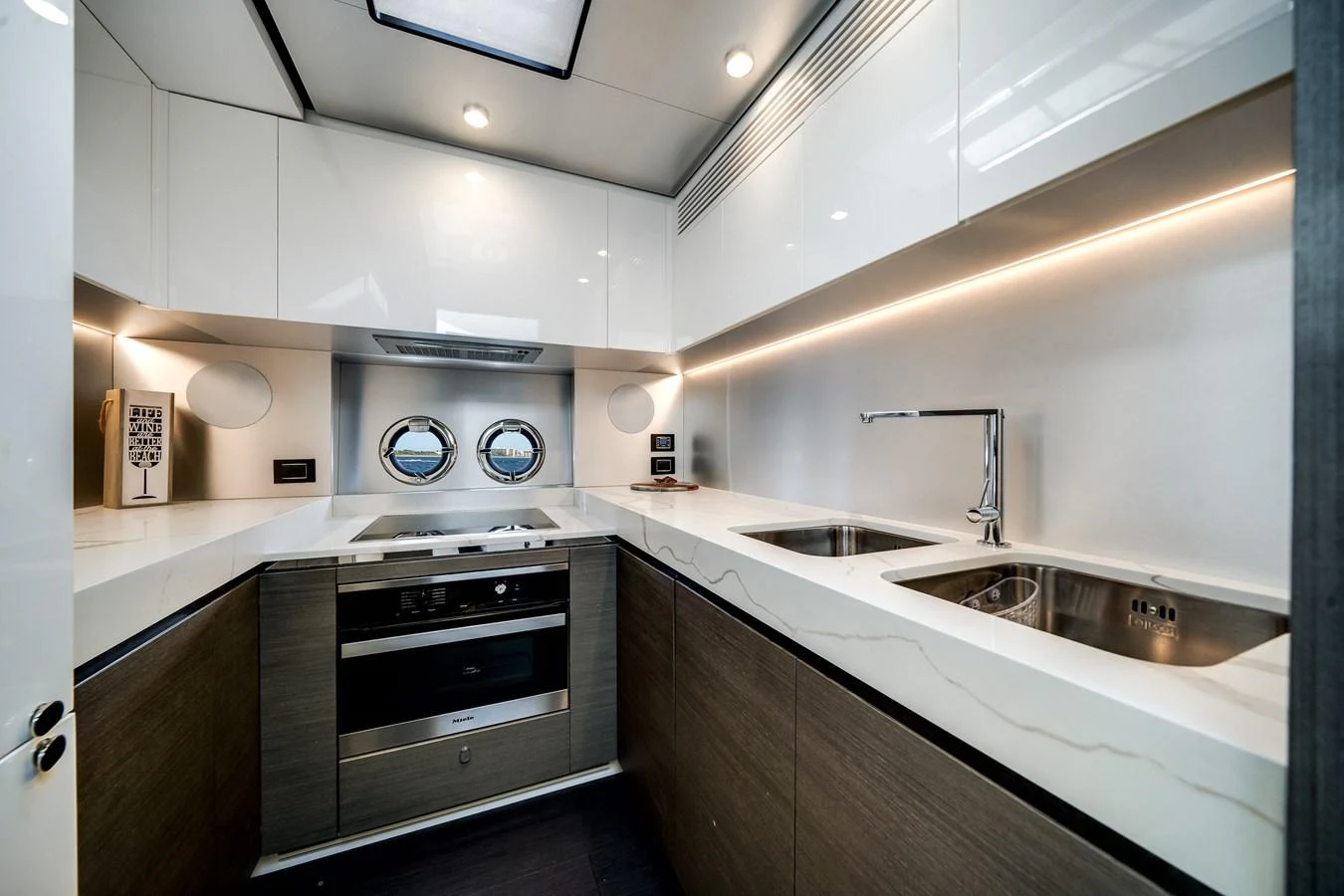 The modern galley features sleek cabinetry, high-end appliances, and ample counter space. aboard PARTNERSHIP V Yacht for Sale