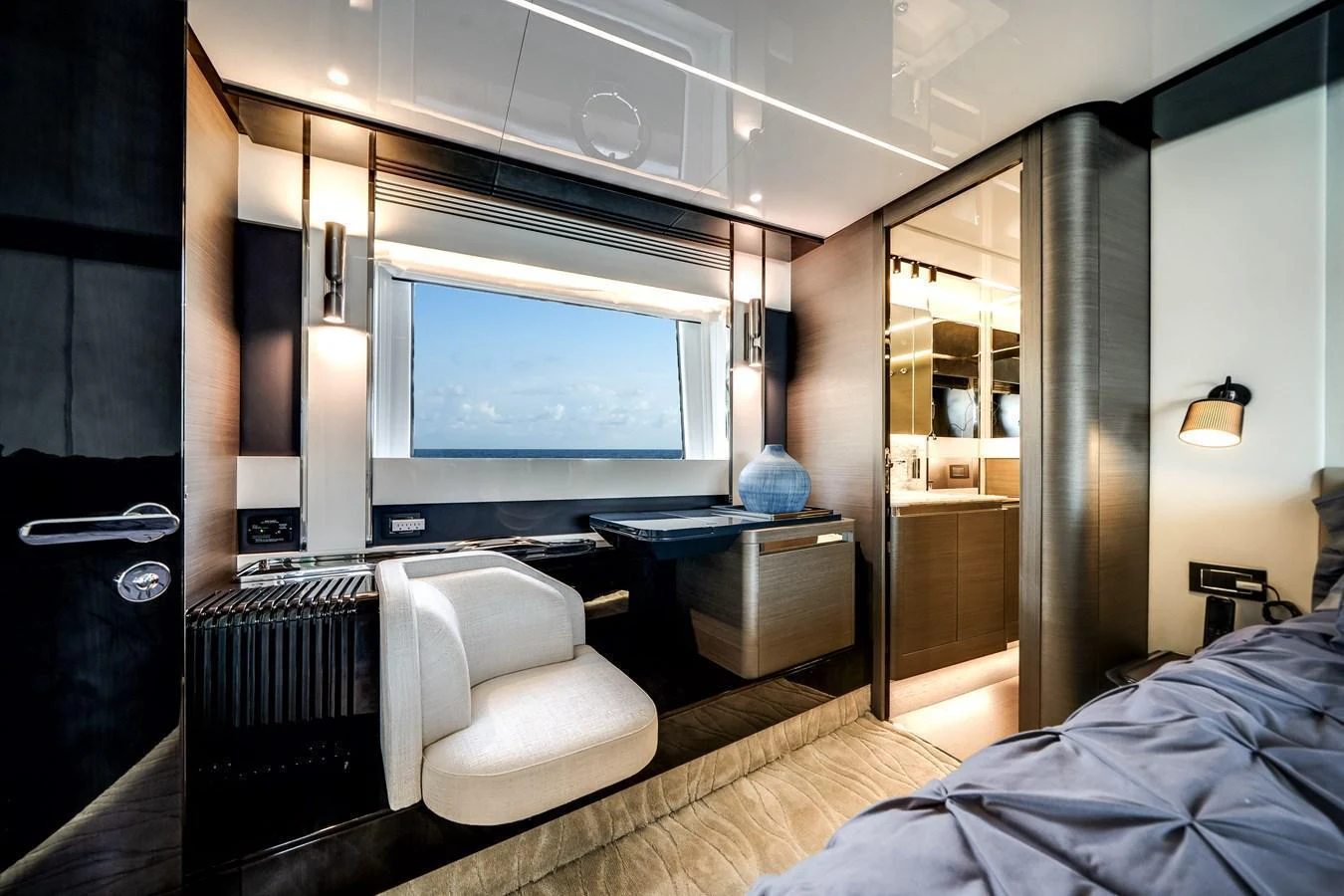 A luxurious stateroom featuring modern furnishings and a large window with an ocean view. aboard PARTNERSHIP V Yacht for Sale
