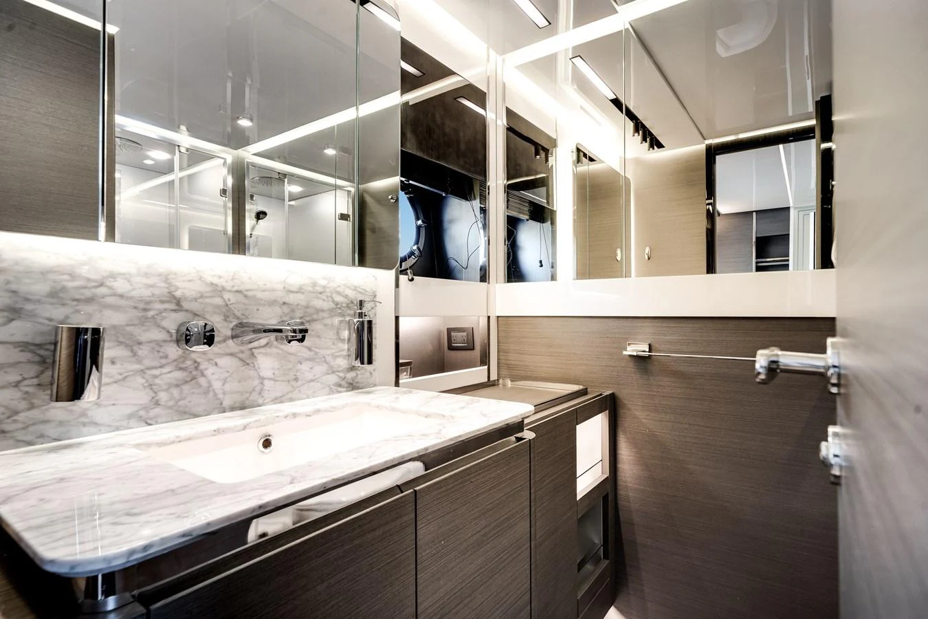 The yacht's bathroom features sleek, modern design with high-end fixtures and a luxurious marble countertop. aboard PARTNERSHIP V Yacht for Sale