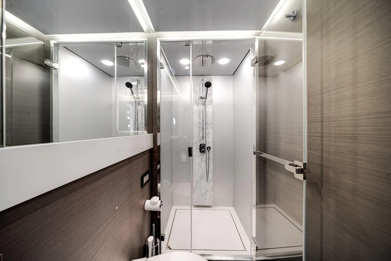 The yacht's bathroom features a modern shower with glass doors and sleek fixtures. aboard PARTNERSHIP V Yacht for Sale