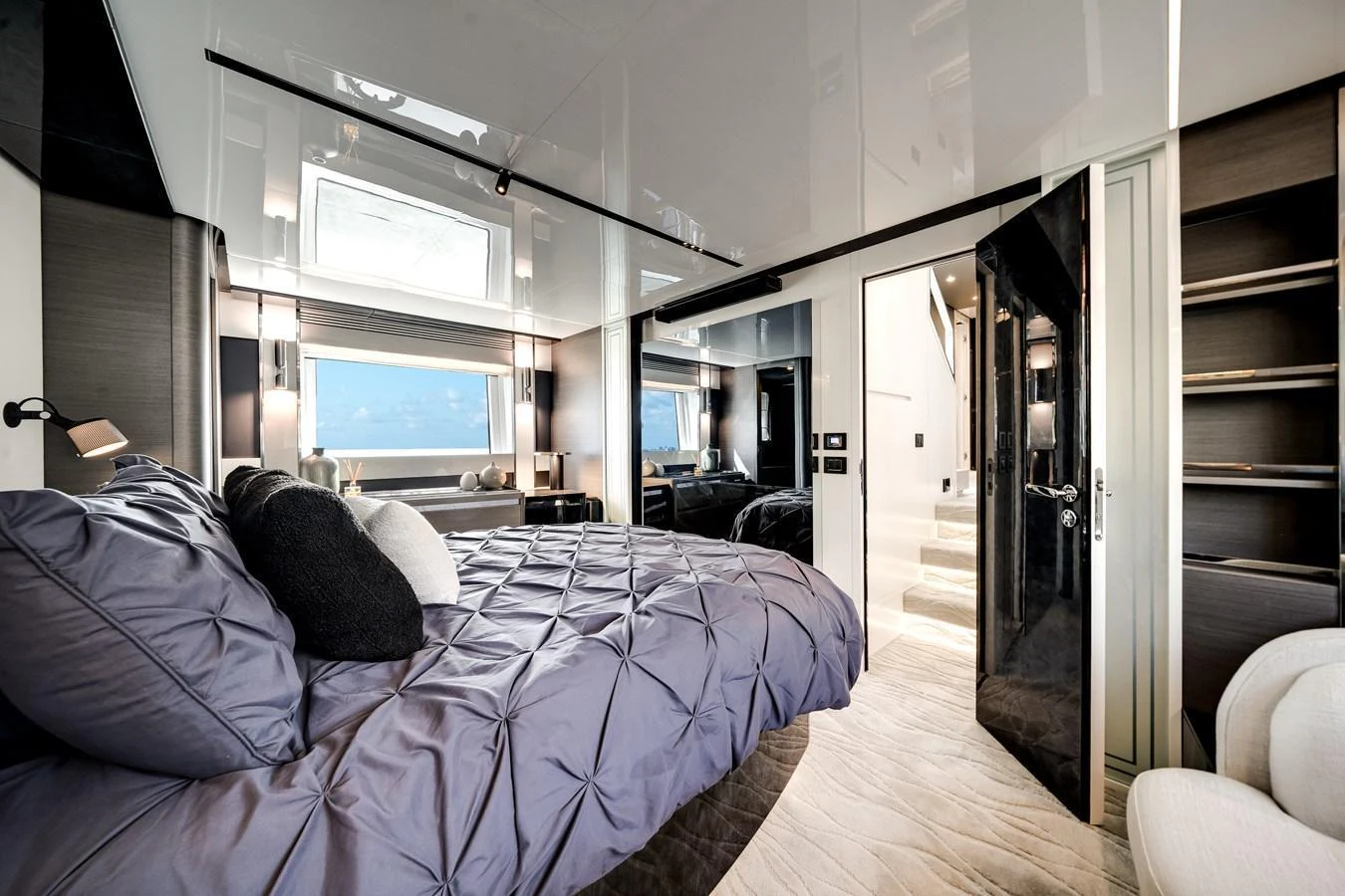 The stateroom features a luxurious bed with plush bedding and modern decor. aboard PARTNERSHIP V Yacht for Sale