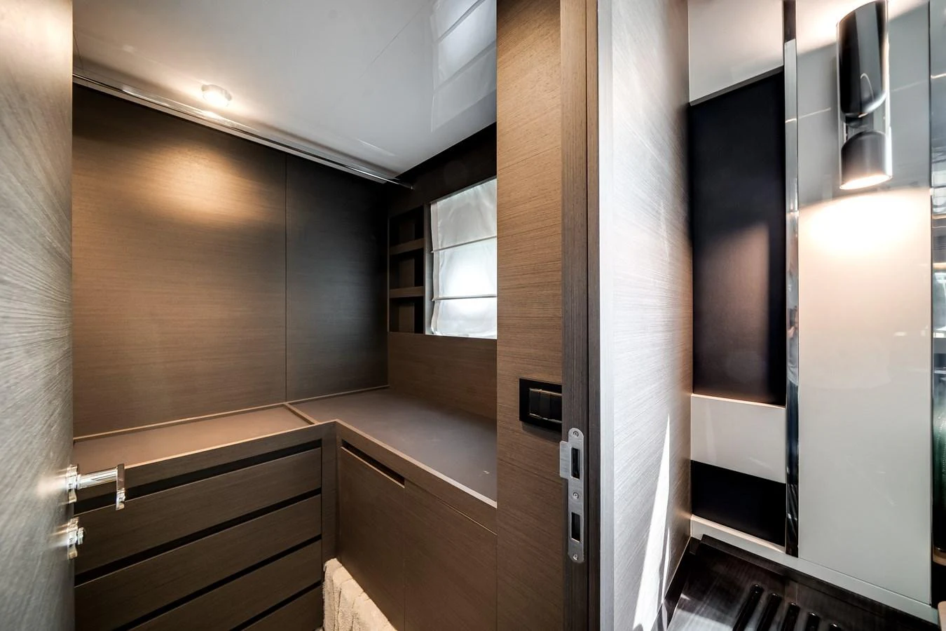 A sleek and modern interior space with contemporary finishes and ample storage. aboard PARTNERSHIP V Yacht for Sale