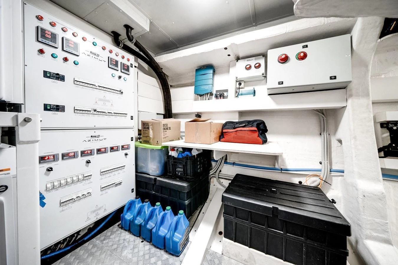 The engine room features well-organized control panels and storage solutions. aboard PARTNERSHIP V Yacht for Sale