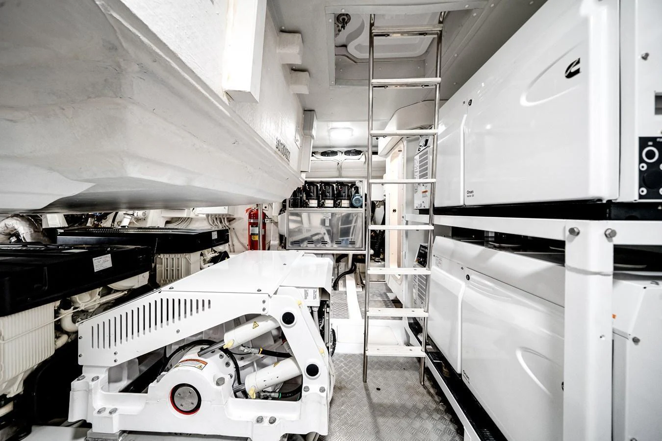 The image showcases the yacht's pristine engine room with well-organized machinery and equipment. aboard PARTNERSHIP V Yacht for Sale